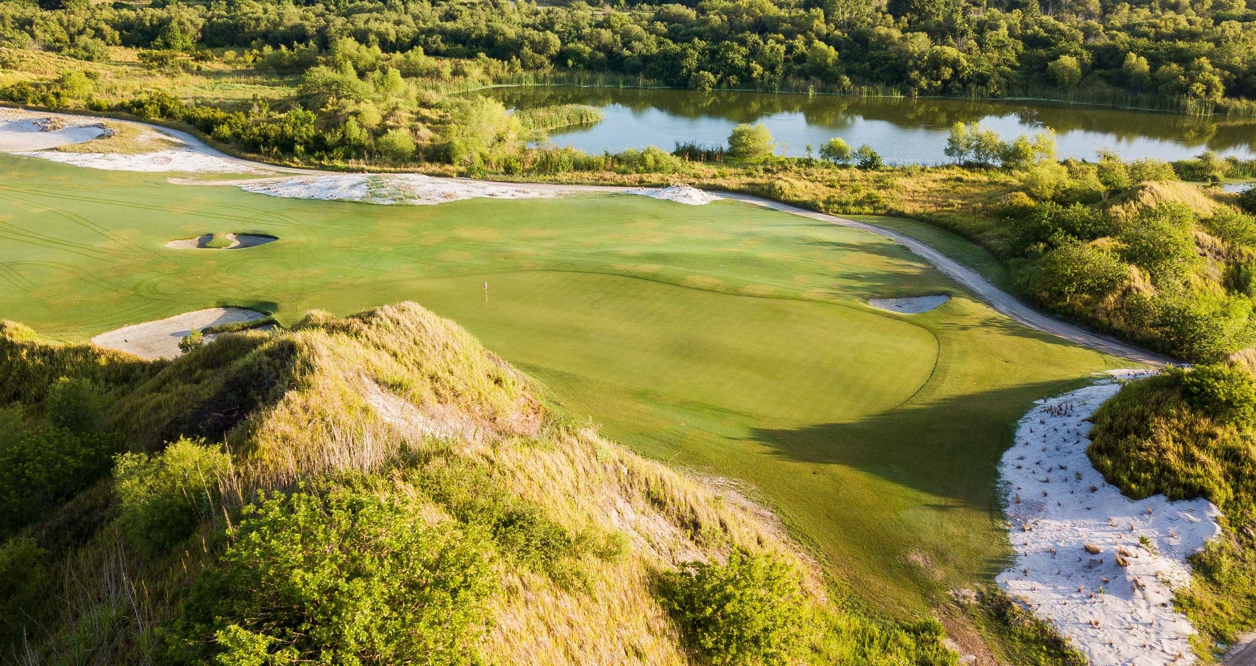 Looking down on a golf course with varied terrain