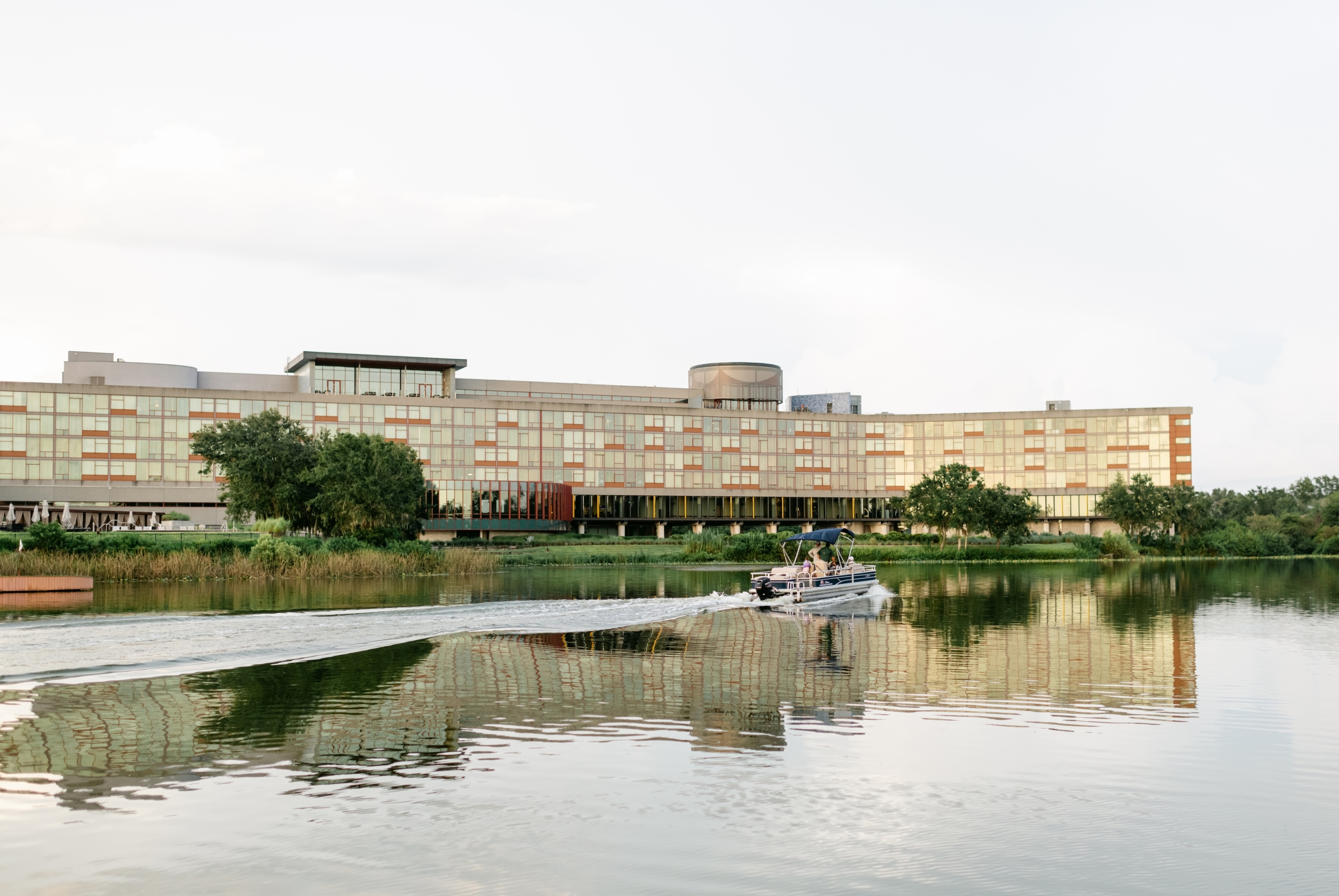 A boat motors past the Streamsong lodge on a guided fishing tour