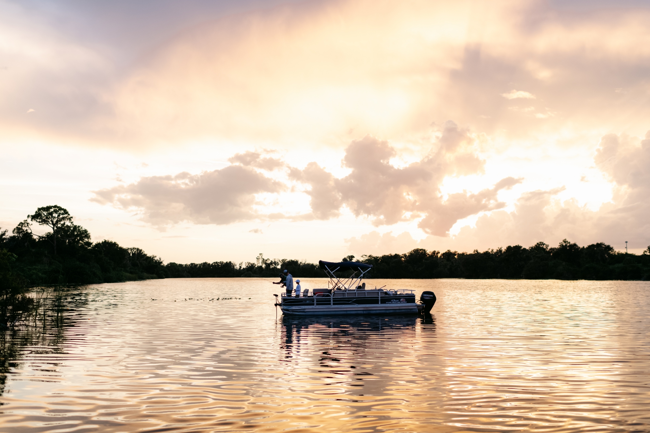 A fishing boat at sunset on a guided fishing tour at Streamsong