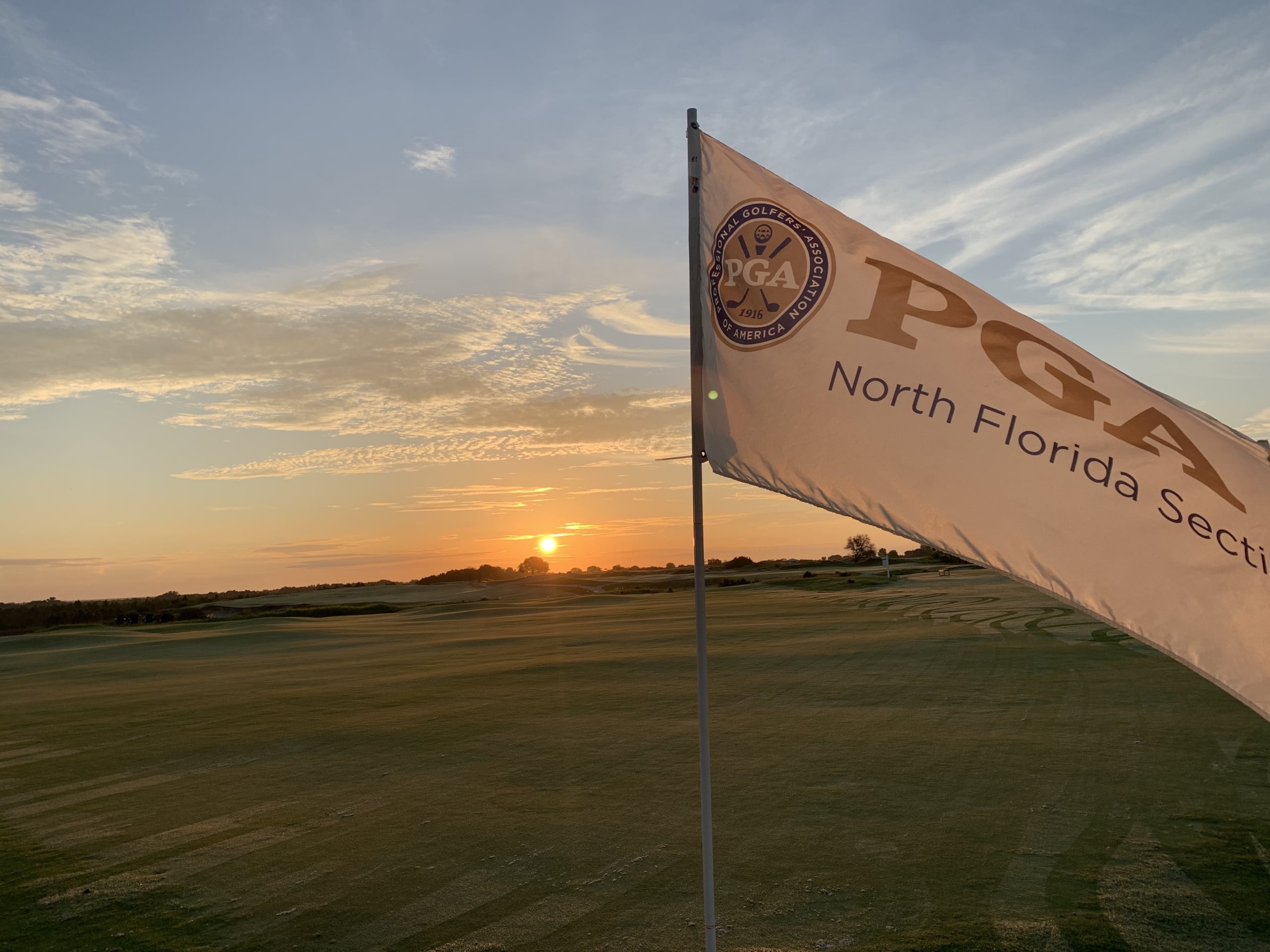 A PGA flag flies at a hole on a Streamsong golf course